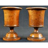 Treen - a pair of 19th century turned oak campana mantel vases, 14.5cm high