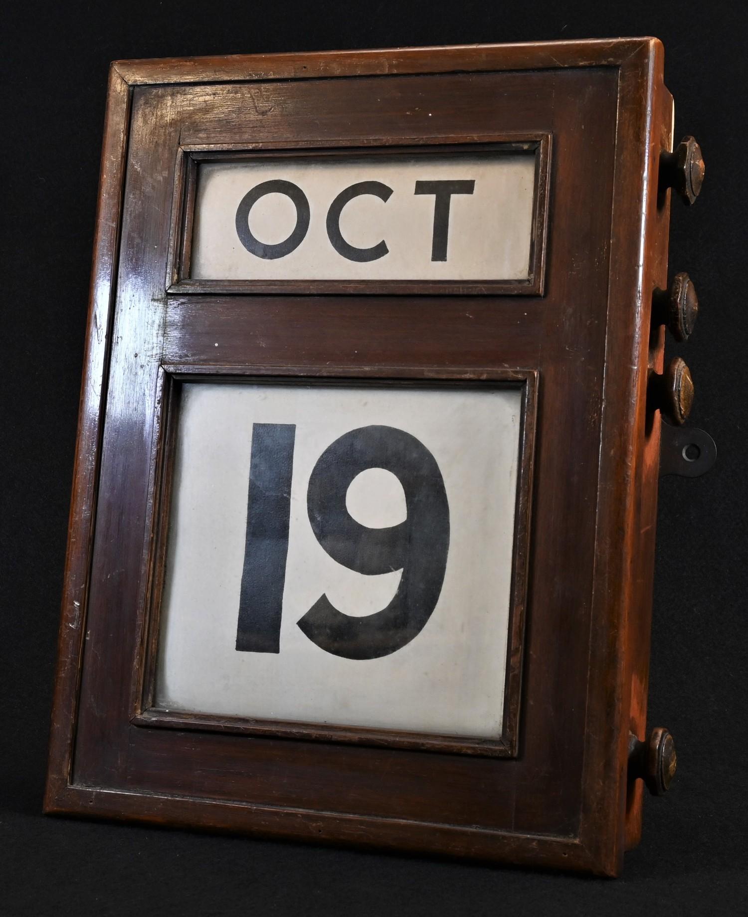 An early 20th century Scottish mahogany wall mounted perpetual calendar, by Fairfield S & E Co