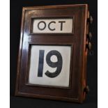 An early 20th century Scottish mahogany wall mounted perpetual calendar, by Fairfield S & E Co