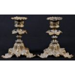 A pair of 19th century gilt bronze candlesticks, detachable sconces, triform bases, cast