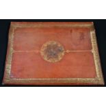A Victorian gilt-tooled terracotta morocco leather rectangular folio, the cover blocked in gilt with