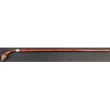 A Black Forest gentleman's novelty walking cane, the curved handle carved as the head of a fox,