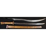 A Chinese sword, 56.5cm straight single-edged blade, horn hilt and scabbard, carved with ferocious