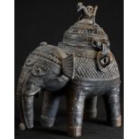 A 19th century Indian dark-patinated bronze censer, as an elephant, the hinged cover as a stylized