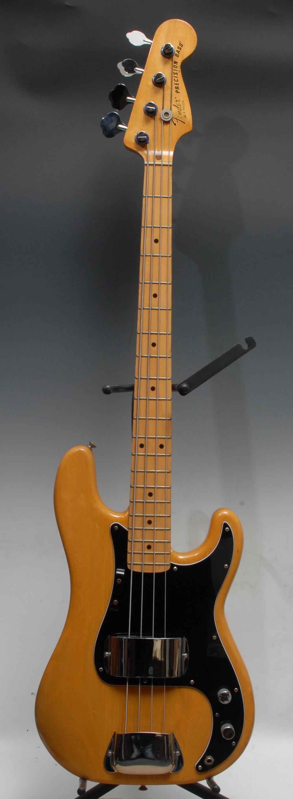 A Fender Precision electric bass guitar USA, natural wood body, maple neck, black pickguard. - Image 2 of 16