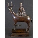 A Chinese bronze altar censer, cast as Shou Lao upon a deer, a peach in his hand, square base,