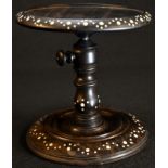 An early 19th century Anglo-Indian coromandel table top adjustable candle stand, dished top,