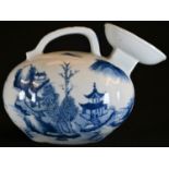 A Chinese ovoid ewer, decorated in tones of blue and white with pagodas in a monumental landscape,