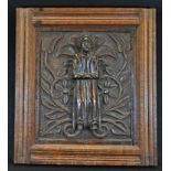 An 18th century oak rectangular panel, carved with a field of flowering scrolling leafy branches,