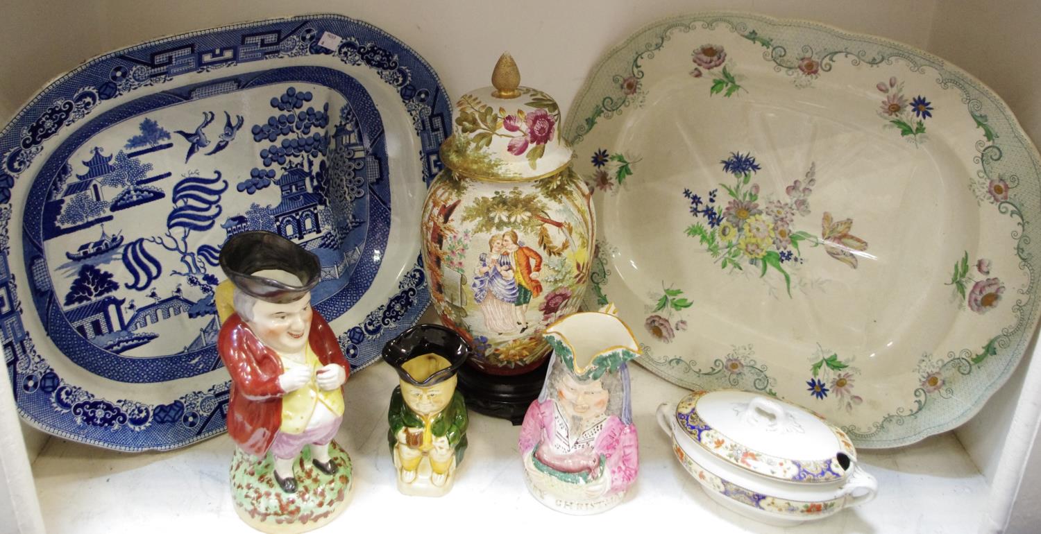 A 19th century Staffordshire Willow pattern meat plate; another Berlin Flowers pattern; a '