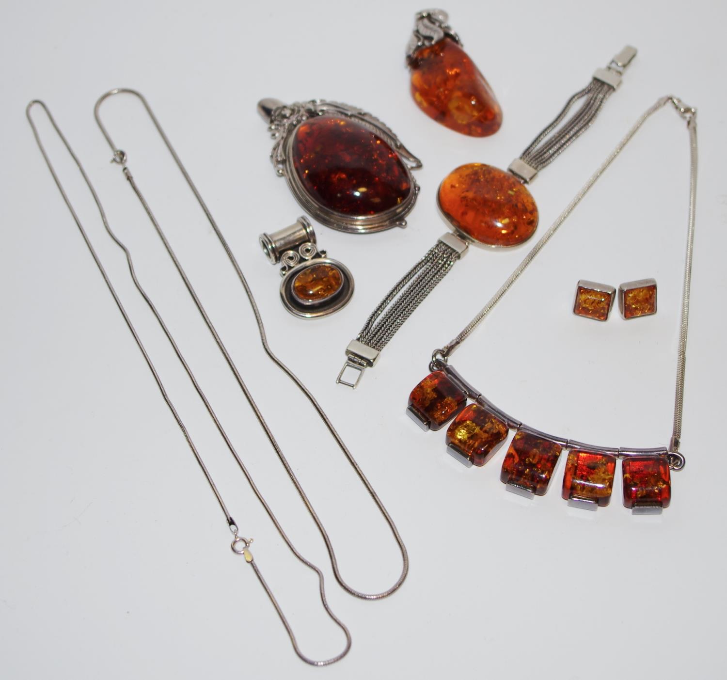 A contemporary Silvarious silver & Baltic amber pendant; a contemporary silver and Baltic amber