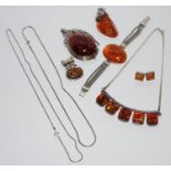 A contemporary Silvarious silver & Baltic amber pendant; a contemporary silver and Baltic amber