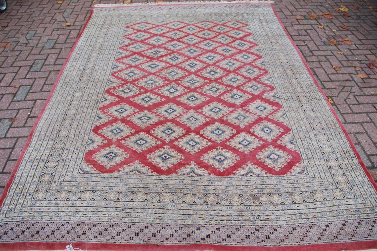 Rug - a hand woven rug decorated with geometric designs in tones of cafe-au-lait, grey and cream