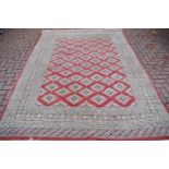 Rug - a hand woven rug decorated with geometric designs in tones of cafe-au-lait, grey and cream