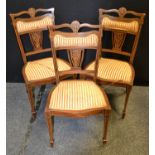 A set of three late Victorian mahogany salon chairs inlaid in coloured woods, c.1900