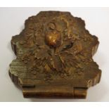 A Black Forest pocket watch stand, folding for travel, carved with fruiting vine, 8cm long, c.1870