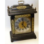 An early 20th century Enfield Clock company ebonized bracket clock, two tone silvered gilt dial,