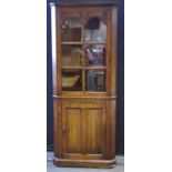 A priory style oak corner cabinet glazed door to top linen panel door to base