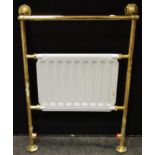 A modern radiator and brass towel rail 66cm wide, 95cm high;