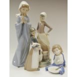 A Nao figure, child seated with bowl between his legs; others at prayer; Lladro farm girl, etc (4)