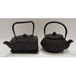 Japanese Interest - a cast iron teapot on stand; another circular; a wood block print etc (4)