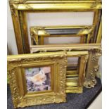 Five ornate picture frames, all gilt but one, the largest 69cm x 79cm, [5]