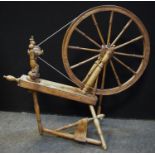 An early 20th century spinning wheel, 12 spoke wheel, pedal base, c.1910