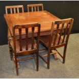 An oak drawer leaf table and two pairs of oak dining chairs (5)