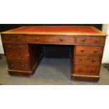 A Late Victorian pedestal desk, leather inlaid top, one long drawer and two short to freeze knee-