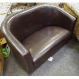 A brown faux leather two seat sofa. 81cm high x 125cm wide x 70cm deep.