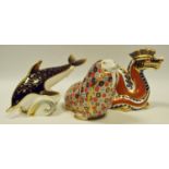 A Royal Crown Derby paperweight, Walrus, printed mark, gold stopper; Dragon, printed mark, gold