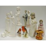 A Goebel Robin; another smaller; a Lladro figural group of Groom & Bride; a NAO figure Girl &