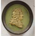A 19h century portrait relief, of George II, in gilt on a green ground, integrated frame, 66cm diam