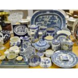 A quantity 19th century and later blue and white ware, some Willow pattern, comprising jugs, plates,
