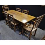 A Titchmarch and Goodwin oak rectory dining suite, refectory table six chairs, rectangular table