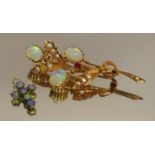 An Edwardian opal garnet and seed pearl floral spray brooch, 9ct gold mount; a small cross (2)