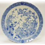 A 19th century Chinese Blue and white charger, decorated with birds of paradise amongst blossoms and