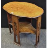 An arts and crafts shaped oval side table, pierced splat legs, tied block feet, 75cm x 50cm