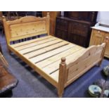 A contemporary pine double bed, head and foot board, 147cm wide