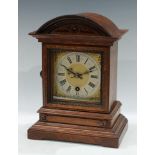 A late 19th century oak bracket timepiece, architectural case, Roman numerals, single winding holes,