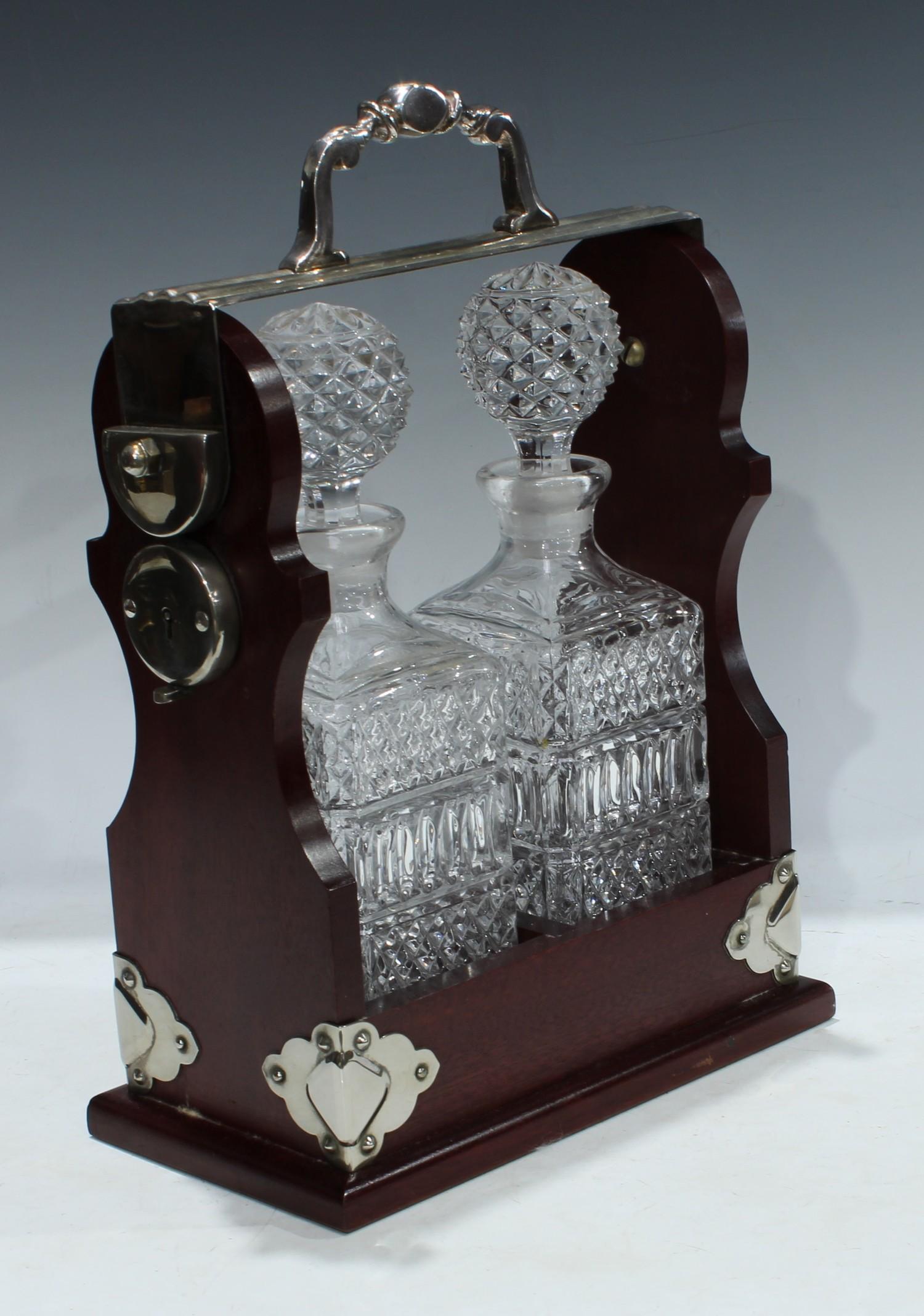 A mahogany two bottle tantalus, silver plated handle and mounts, 34cm high, 25cm wide - Image 2 of 2