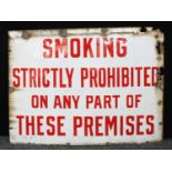 A large rectangular enamel sign, 'Smoking Strictly Prohibited On Any Part Of These Premises', 91cm x