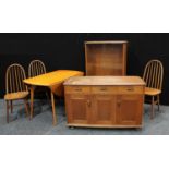 A 1950s Ercol Elm circular dropleaf dining table, 112cm diameter, pair of tall back Windsor