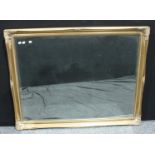 A large neoclassical style gilt framed wall mirror, beveled plate, 132cm x 103cm