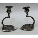 A pair of Art Nouveau W.M.F style pewter candlesticks