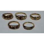 An 18ct gold ring, set with ruby and diamond chips, other 18ct gold rings set with stones, 12g (5)
