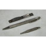 A Truscraft silver adaptable pen/pencil; a silver plated retractible pencil; a silver identity