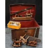 A large collection of wood planes and tools, contained in tin trunk