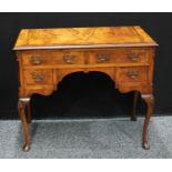 A Queen Anne style walnut low boy, oversailing rectangular top above two long and two short drawers,
