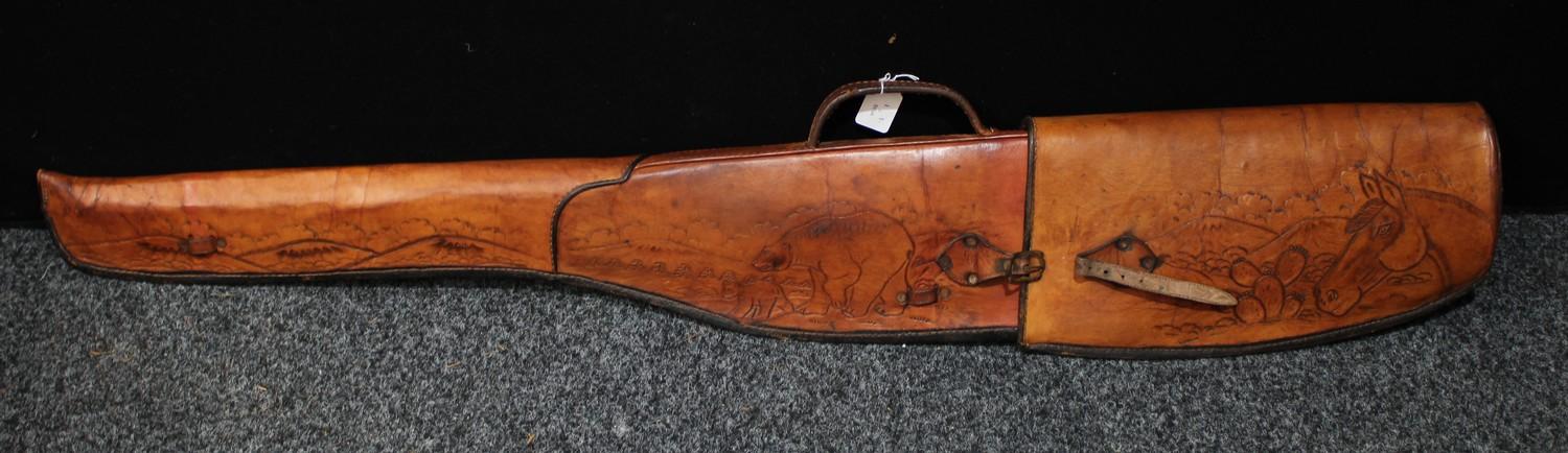 Militaria - a leather gun slip, embossed with moose and bears, buckle fastener